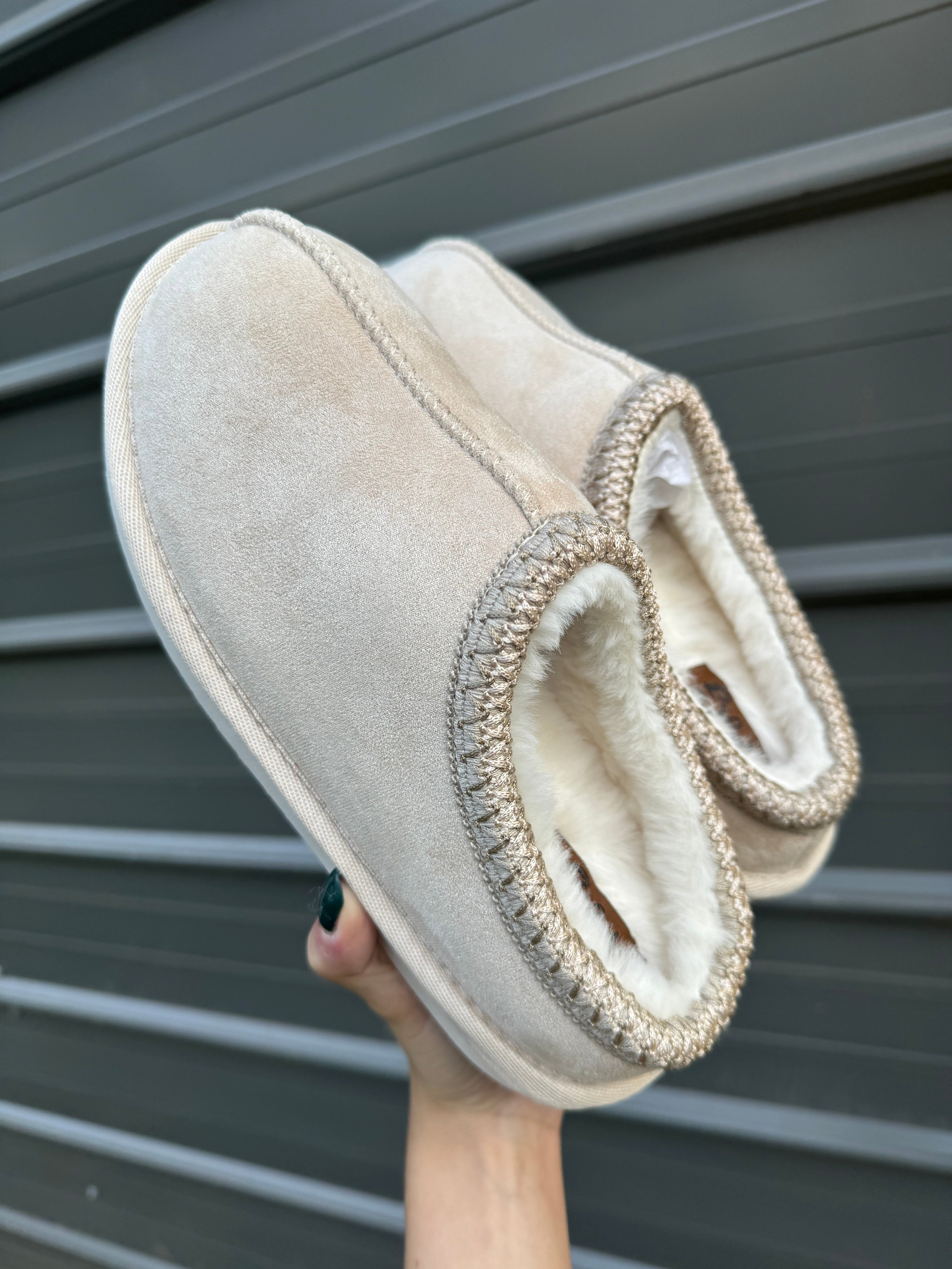 Cow print bruin slippers