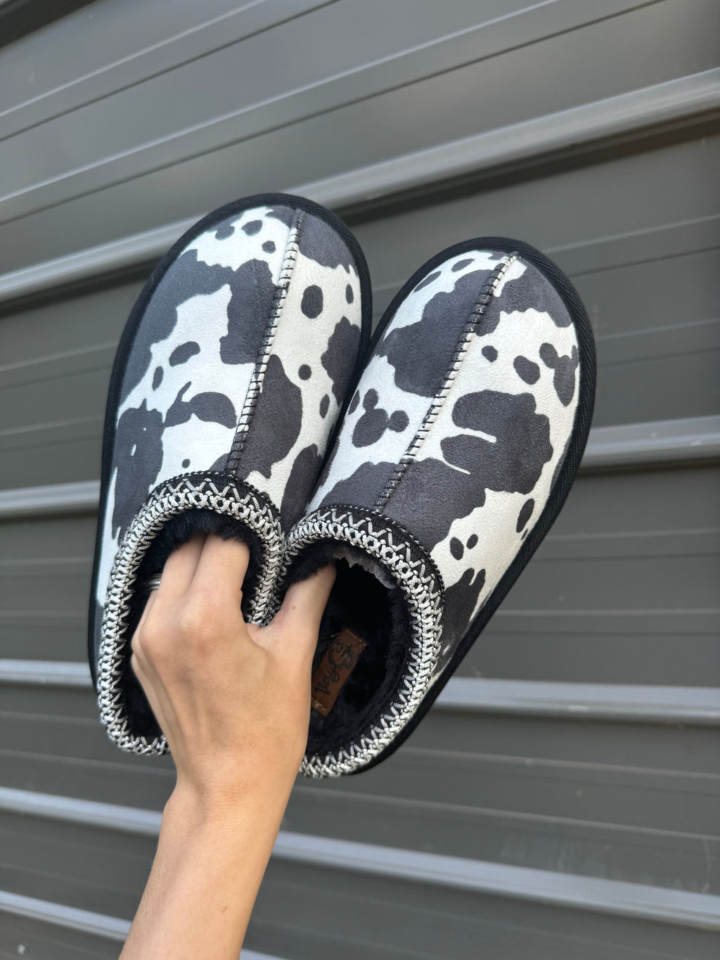 Cow print bruin slippers