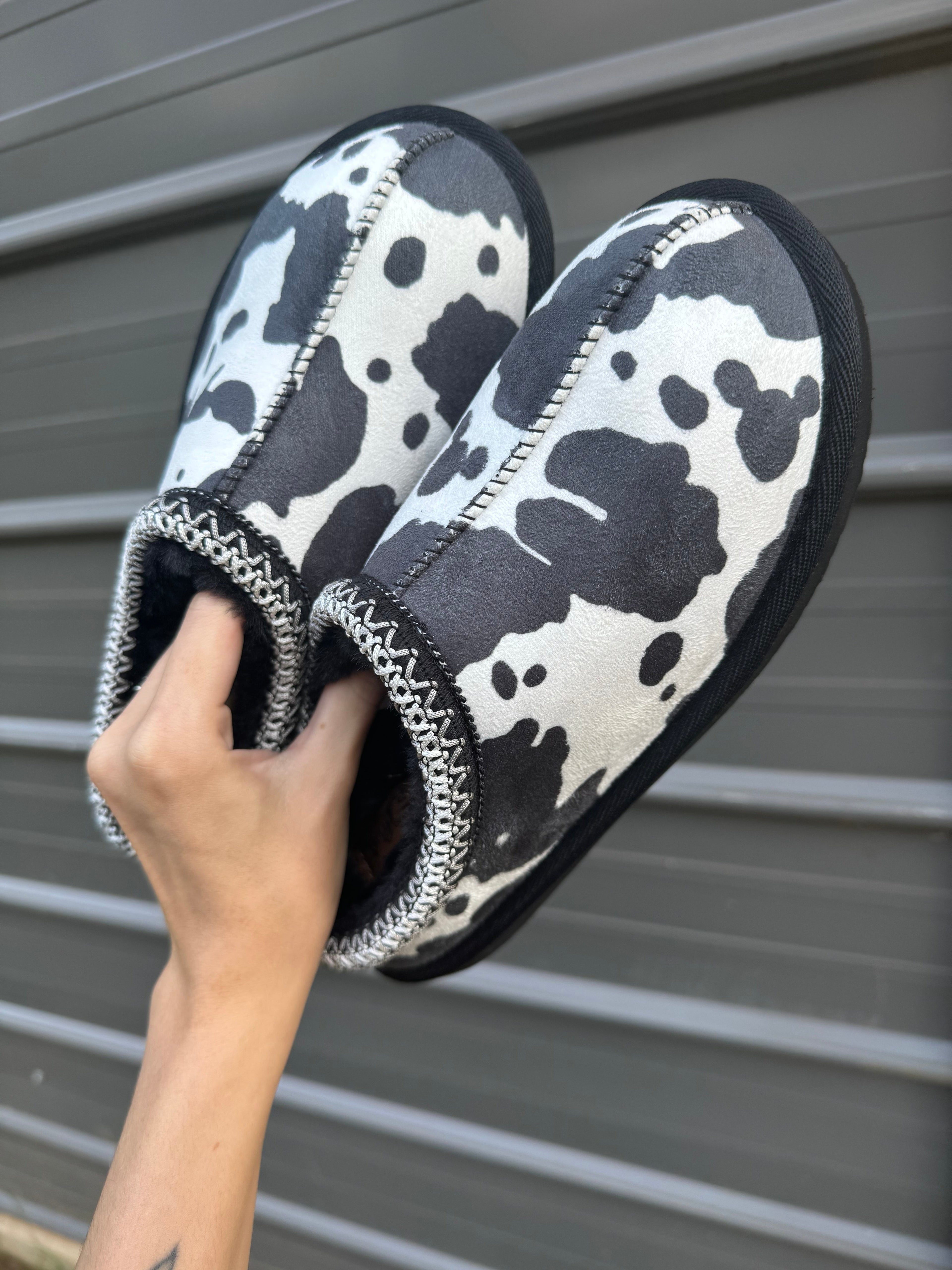 Cow print bruin slippers