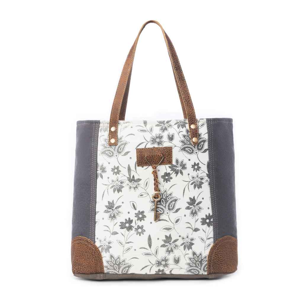 Myra Abstract Key Tote Bag for Women with upcycled canvas and leather accents in floral print with tasseled key detail