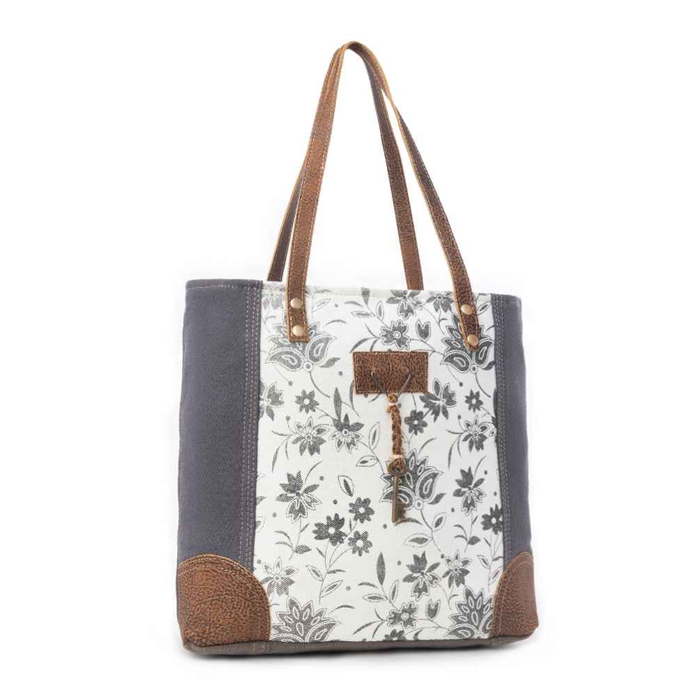 Myra Abstract Key Tote Bag for Women with upcycled canvas and leather accents in floral print with tasseled key detail