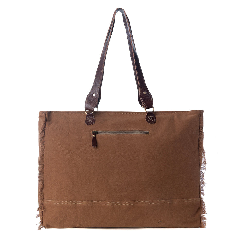 Myra Juniper Weekender Bag for Women with upcycled canvas and hairon hide with embossed leather detail