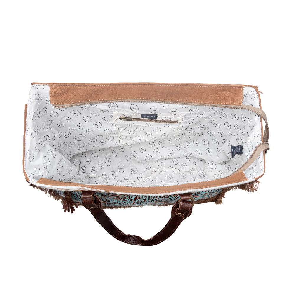 Myra Juniper Weekender Bag for Women with upcycled canvas and hairon hide with embossed leather detail